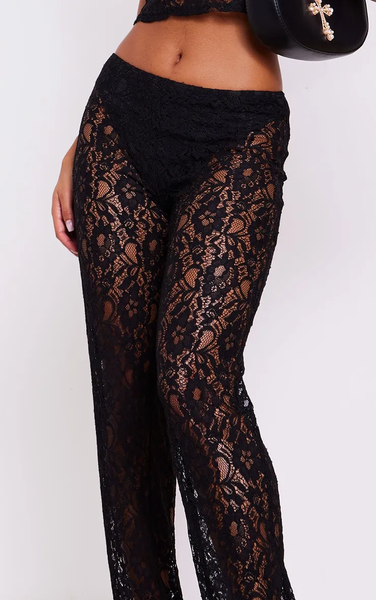 Pantalon noir à taille haute et dentelle transparente coupe évasée